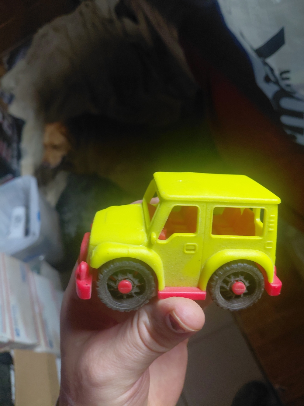 yellow toy vehicle is a B. toys Happy Cruisers Mini 4x4, featuring chunky wheels